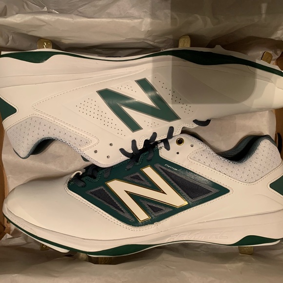 white and gold new balance spikes